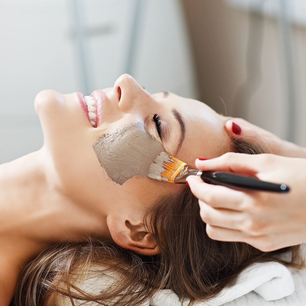 Picture of woman with facial mask in beauty salon
